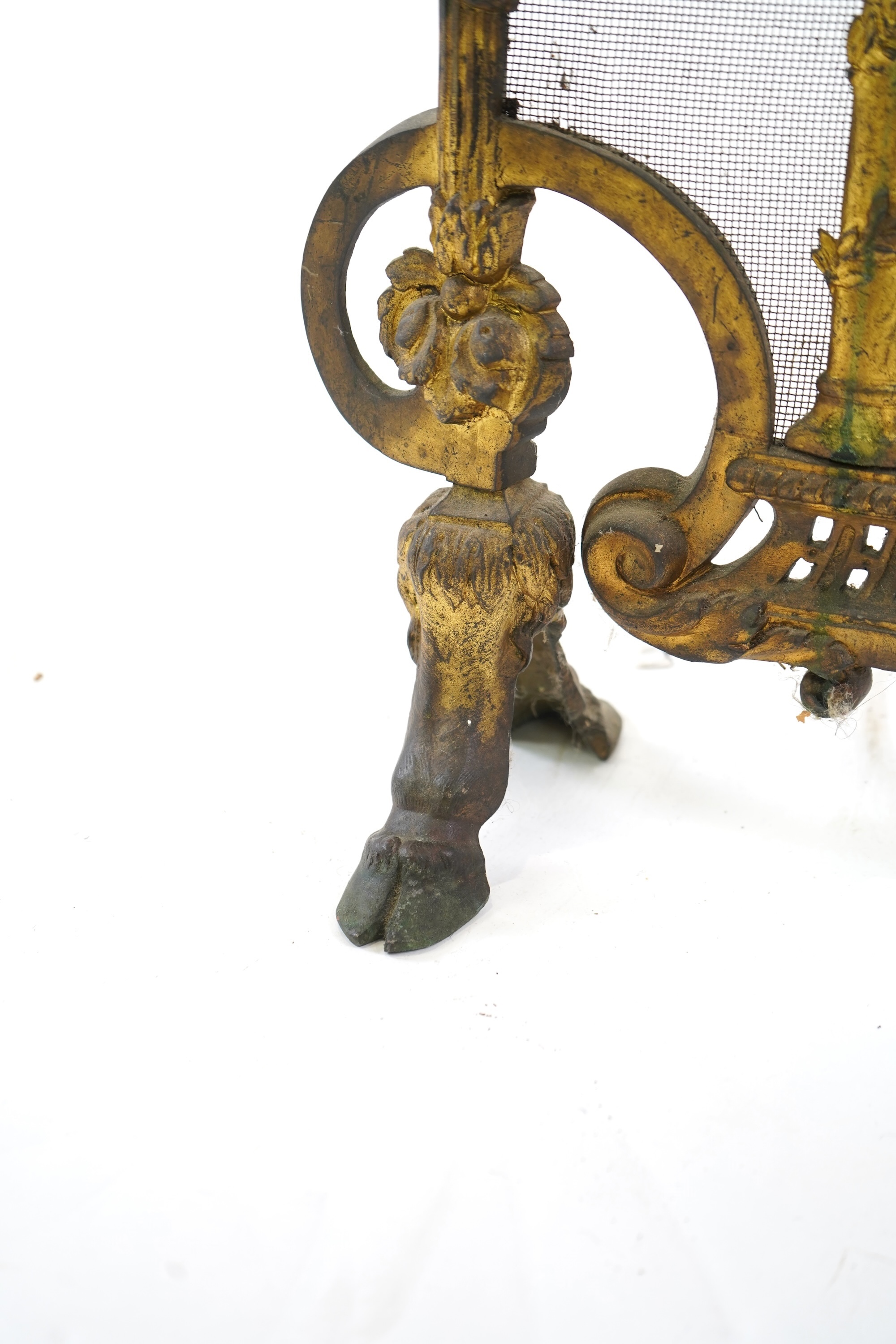 A Louis XVI style gilt bronze and iron mesh fireguard, late 19th century